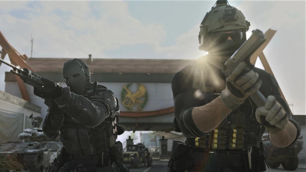 Screenshot of Modern warfare 2 players holding guns near parked cars
